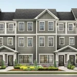Architectural rendering of Empire Legacy rear lane townhomes featuring modern grey siding, stone accents, multiple gables, and second-story balconies.