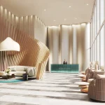 Modern luxury lobby interior at Aquanova Condos featuring high ceilings, a turquoise reception desk, sculptural wood slat wall accents, and floor-to-ceiling windows.