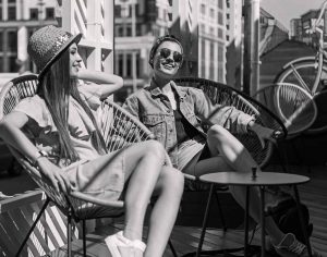 young female students relaxing in the sun - AdobeStock 121021573 e1565275690554 300x236