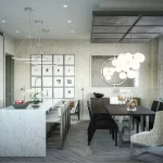 Modern open-concept kitchen and dining area at The Towns on Bayview, showcasing a large marble-waterfall island with bar stools, minimalist white cabinetry, a dark wood dining table, and contemporary bubble chandelier lighting.