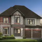 Luxury 42' detached home at Caledon Trails with a prominent stone and brick exterior, double-car garage, and large architectural windows overlooking a manicured lawn.