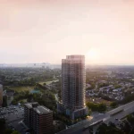 High-angle aerial rendering of Alba Condos, a modern high-rise skyscraper standing above a surrounding urban neighborhood at sunset.