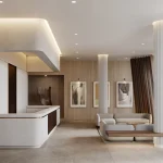 Modern luxury lobby at Alba Condos with a white stone reception desk, contemporary lounge seating, wood-paneled walls, and a sleek fireplace.