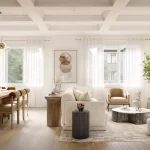 Bright and airy living and dining room interior at The Heights of Harmony East, featuring a marble-surround fireplace, a large wooden dining table with globe lighting, and expansive windows with sheer curtains.