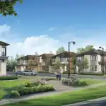 Wide-angle view of the Esprit Newmarket community streetscape showing beautifully landscaped walkways, street lamps, and a row of contemporary detached homes under a clear blue sky.