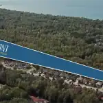 Aerial view of the Shoreline Point development site in Wasaga Beach, highlighting the community's proximity to lush forests and the Georgian Bay shoreline.