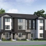 Modern three-story rear lane townhomes in Hawthorne East Village featuring a contemporary mix of grey brick, stone masonry, and dark paneling with flat roof accents.