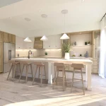 Bright modern kitchen in an Avon Park home with a large white island, light wood cabinetry, and minimalist decor.