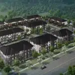 Aerial rendering of the Alister at Solterra townhome community featuring modern multi-story residential buildings with black roofs, manicured green spaces, and a scenic wooded backdrop.