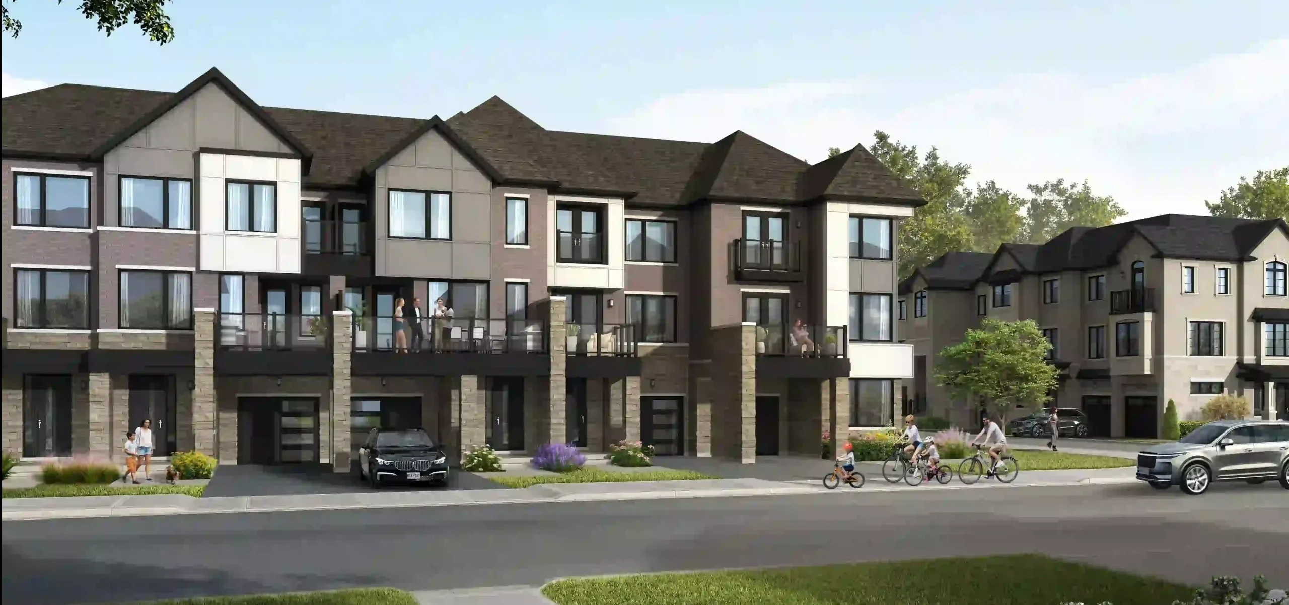 Lively streetscape rendering of The Nine community, showing modern multi-level townhouses with glass balconies, families cycling on the road, and professional landscaping.