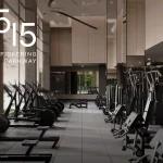 State-of-the-art fitness centre at 1515 Pickering Parkway, featuring floor-to-ceiling windows, professional-grade rowing machines, and strength training equipment in a high-ceiling, modern gym facility.