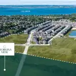 Aerial drone view of the Georgina View community site in Keswick, highlighting its proximity to Lake Simcoe, adjacent Georgina Heights neighborhood, and surrounding green spaces.