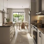 Modern open-concept kitchen interior in a Cornerstone home featuring a large island, dark countertops, stainless steel appliances, and an adjoining dining area.