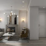 Open-concept luxury living room at Thornhill Heights with a stone fireplace, modern gold chandelier, neutral furniture, and view of the kitchen.