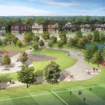 Aerial view of the community park at Newbrook featuring a playground, splash pad, basketball court, and tennis courts surrounded by greenery.