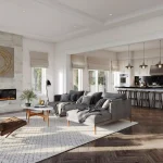 Open-concept interior of a Queen's Landing home featuring a luxury living room with a marble-clad fireplace, dark herringbone hardwood floors, and a modern white kitchen with a black marble backsplash.
