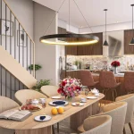Architectural rendering of a modern open-concept kitchen and dining room at Riverbank Place, featuring a wood-slat dining table, circular pendant lighting, and a contemporary kitchen with dark wood cabinetry and a marble backsplash.