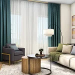 Modern living room interior at Sol Stacked Towns with a neutral sofa, teal floor-to-ceiling curtains, a large circular mirror, and hardwood flooring in an open-concept layout.