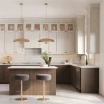 Luxurious modern kitchen interior at St Davids Collection featuring two-tone cabinetry, marble-style countertops, kitchen island with brass pendant lighting, bar stools, and stainless steel appliances.