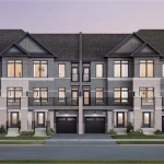 Architectural rendering of modern urban townhomes at Vellore Trails by Arista Homes, featuring a three-story exterior with grey brick, light stone accents, glass balconies, dark garage doors, and large windows under a dusk sky.
