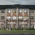 Street-level view of WestHaven at Country Lane mixed-use townhomes featuring ground-floor retail signage space and light grey brick and wood-style siding.