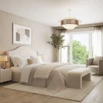 Elegant primary bedroom interior rendering at Kingshaven, showing a neutral-toned design with a plush king bed, large windows looking out to green trees, a stylish armchair, and custom built-in shelving.