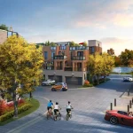 Street-level rendering of the Jefferson Heights community neighborhood, showing a brick and stone townhouse street with residents cycling, walking, and driving on a paved road next to landscaped trees and a nearby pond.