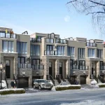 Winter rendering of traditional townhouses at Jefferson Heights, featuring three-story multi-unit homes with stone veneer basements, built-in garages, large windows, and snow-covered rooftop patios under a clear blue sky.