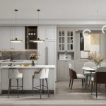 Modern open-concept kitchen and dining area at Bayview Green featuring light grey shaker cabinetry, marble countertops, and an island with seating.