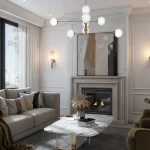 Elegant living room interior at Bayview Green with a cozy gas fireplace, modern chandelier, neutral beige sofa, and large windows.