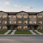 Front exterior rendering of modern three-storey townhomes at The Bogart Hills featuring grey brick cladding, vertical paneling, manicured lawns, and concrete walkways.