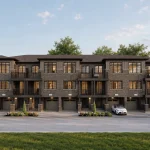 Rear exterior view of modern multi-storey townhouses at The Bogart Hills showing private driveways, built-in garages, and upper-level balconies.