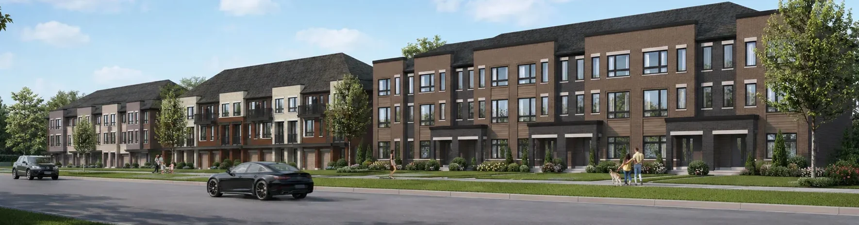 Wide streetscape rendering of the Derry Lane Towns community showcasing modern townhome blocks, paved roads, and landscaped green space.