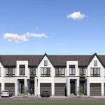 Front elevation view of light-colored brick townhouses at Wellington Place with black window frames, private driveways, and modern exterior design.