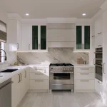 Modern luxury white kitchen rendering at Bayview Heights featuring marble backsplash and countertops, stainless steel gas range with range hood, built-in wall oven, and white cabinetry with brass handles.
