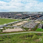 Aerial site plan map of Countryside Urban Towns showing Inspire Boulevard, Russell Creek Drive, open space, and future residential development.