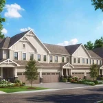 Exterior architectural rendering of modern multi-family townhomes at Liora in Georgina with light grey siding, garage doors, manicured landscaping, and surrounding green trees.