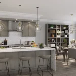 Modern open-concept kitchen and dining area at Lyric by Lynde Creek with a marble waterfall island, pendant lights, stainless steel appliances, and adjacent dining table.