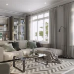 Bright, modern living room at Lyric by Lynde Creek with a section sofa, armchair, workstation nook, chevron area rug, and large light-filled windows.