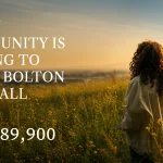 Woman standing in a grassy field at sunset with text reading "A new community is coming to Upper Bolton this fall from $789,900" for North Hill by Solmar.