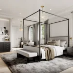 Elegant primary bedroom suite design at Abacot Hill with a black four-poster canopy bed, neutral area rug, large windows, and a built-in morning bar.