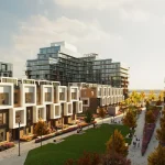 Perspective view of modern townhome facades with geometric white window frames facing a central green park walkway at Elements Milton.