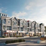Exterior view of coastal multi-story residential buildings at The Breakers with ground-floor boutique retail shops, outdoor seating, and sidewalk landscaping.