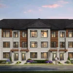 Front elevation rendering of modern three-story townhomes at Valley Brooke showing light grey stone masonry, warm wood accents, large windows, and landscaped walkways.